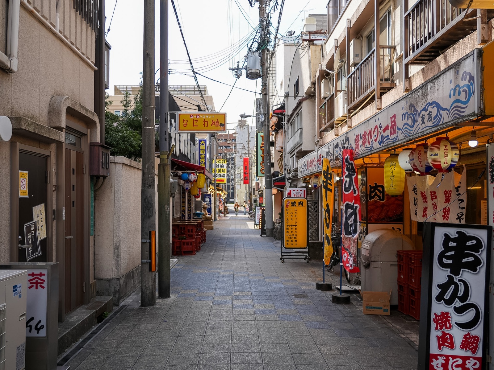 Shinsekai food alley lined with red kushikatsu lanterns